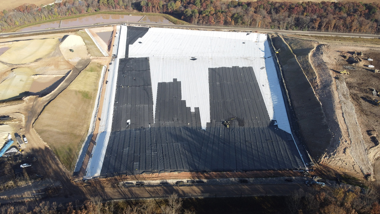 Aerial view of new cell being lined with white HDPE liner at Millersville Landfill in Anne Arundel County, MD