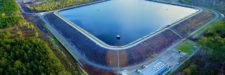 Aerial view of fully lined and filled fresh water reservoir