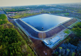 Aerial view of fully lined and filled fresh water reservoir